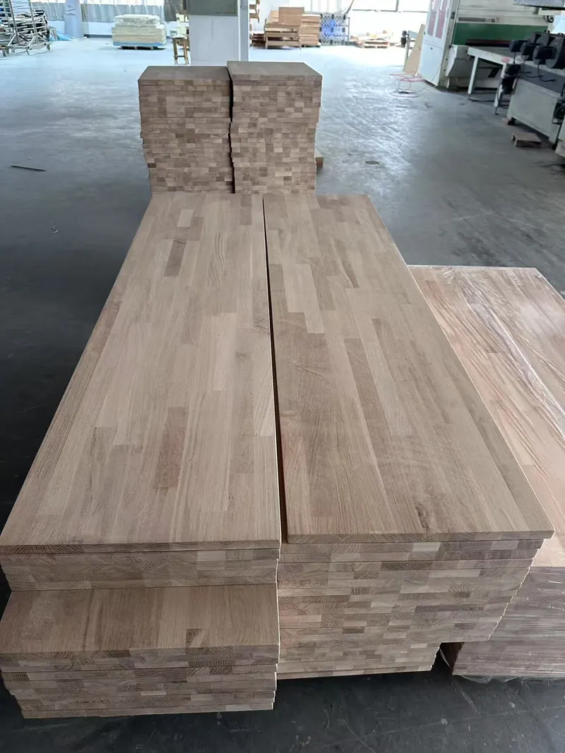 Solid wood countertop panels stacked on pallets in factory